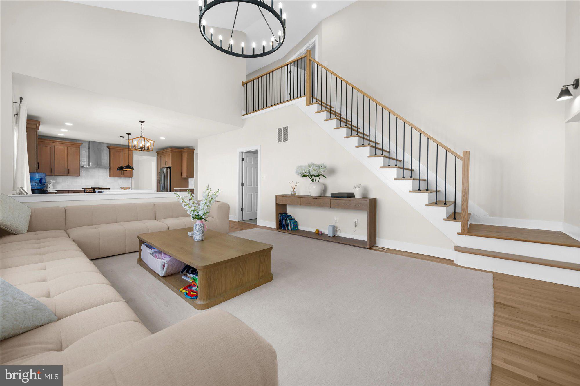 86 Treetops Circle Princeton, NJ 08540 - Photo 12 of 41 a living room with furniture and a chandelier