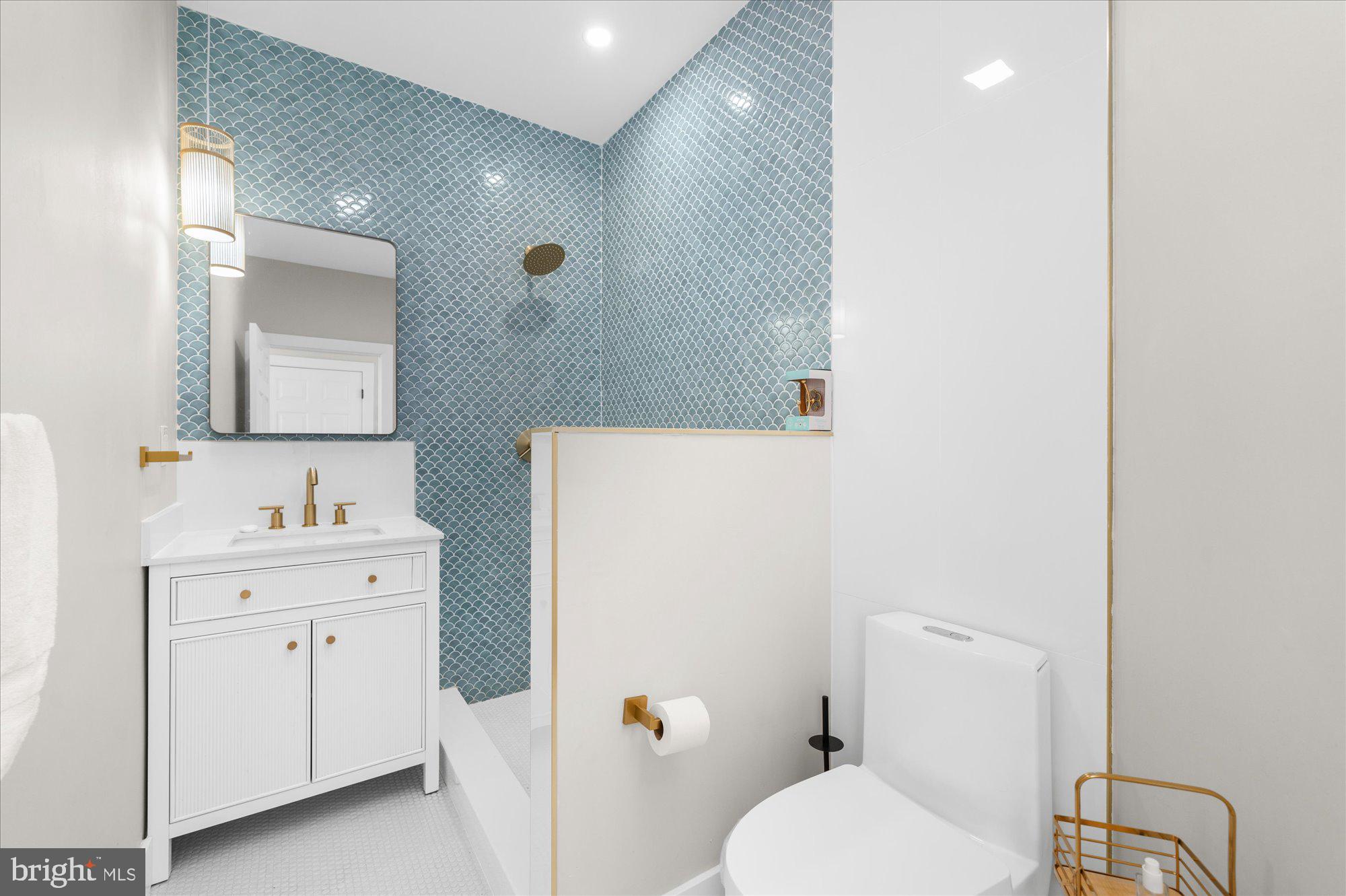 86 Treetops Circle Princeton, NJ 08540 - Photo 17 of 41 a bathroom with a sink a toilet and a mirror