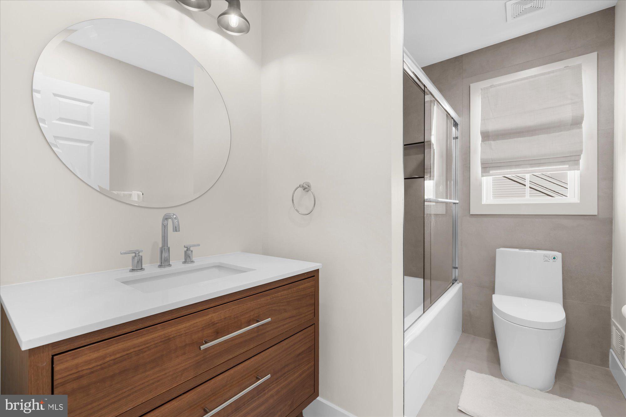 86 Treetops Circle Princeton, NJ 08540 - Photo 27 of 41 a bathroom with a sink a toilet and a mirror