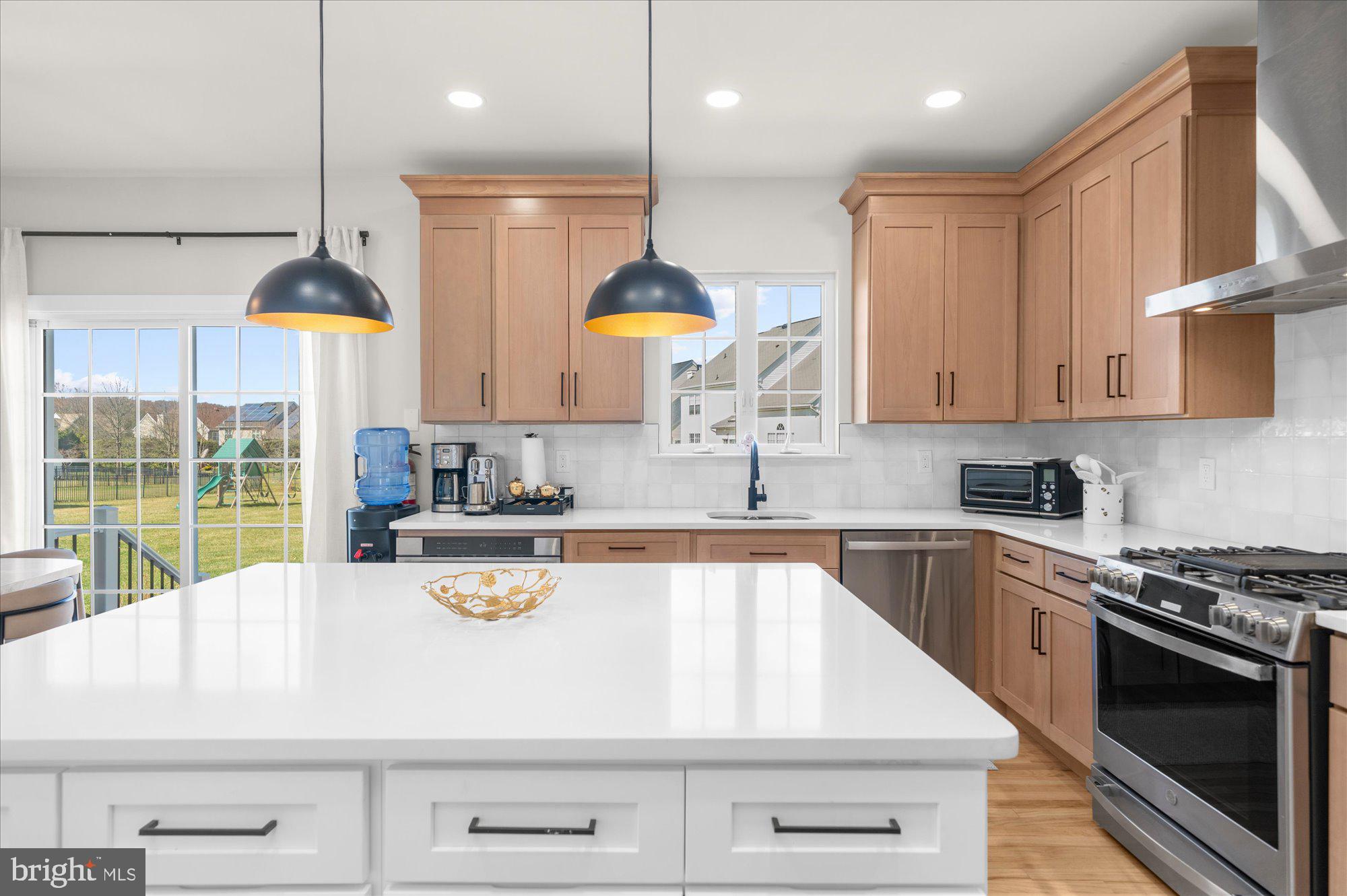 86 Treetops Circle Princeton, NJ 08540 - Photo 6 of 41 a kitchen with a stove a sink a center island and cabinets