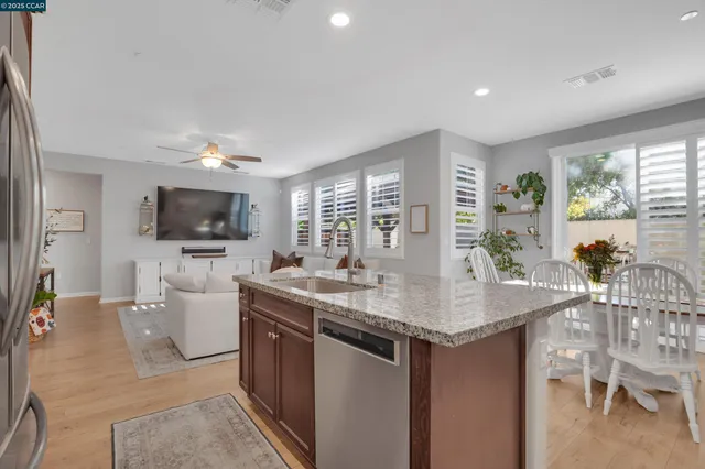a kitchen with a stove a sink and a refrigerator