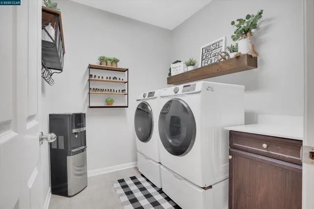 a view of a storage & utility room with washer and dryer