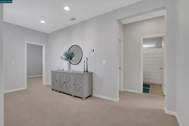 a bed room with a bed and a chair