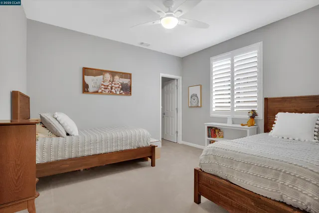 a bathroom with a double vanity sink and mirror