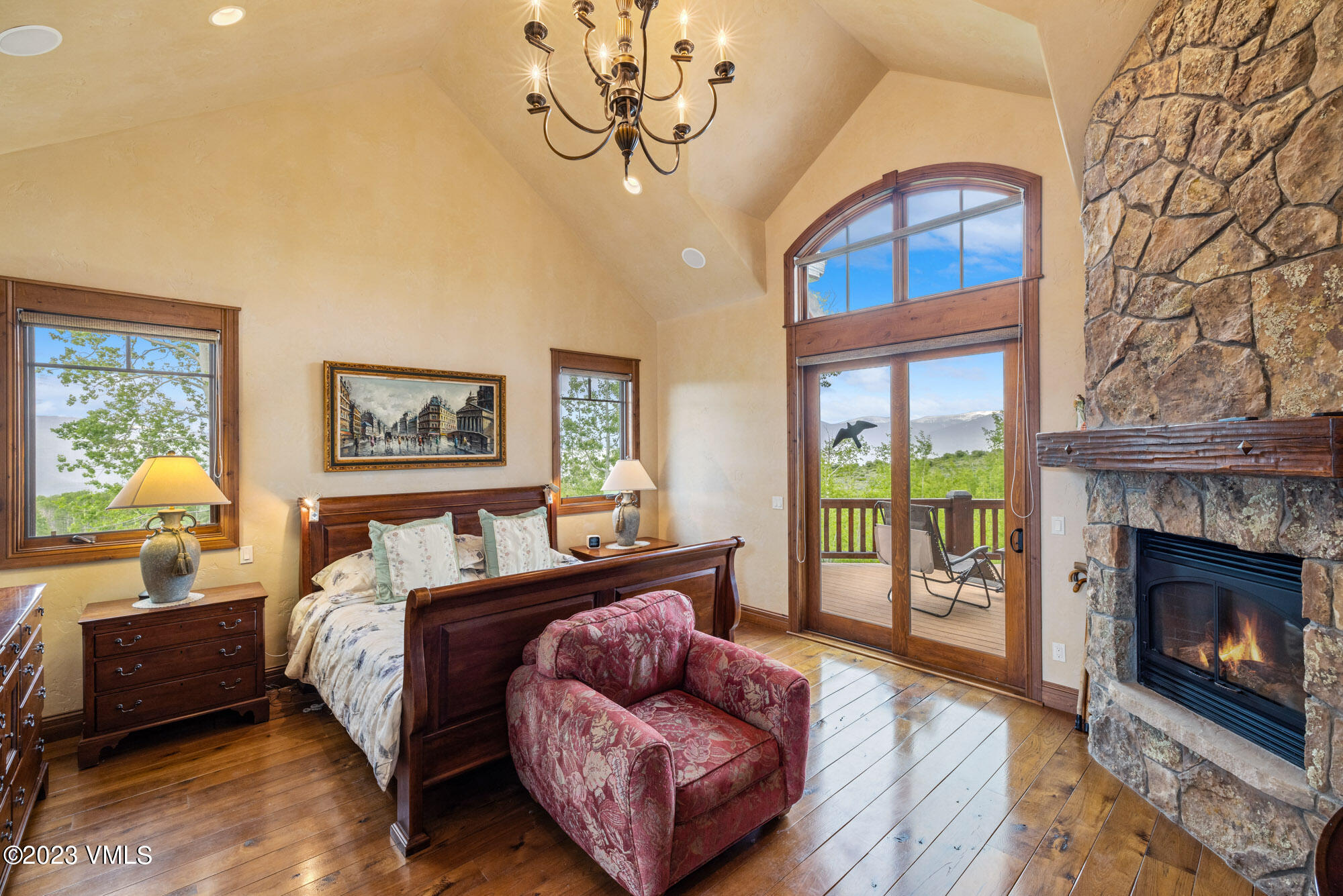 5458 Bellyache Ridge Road Wolcott, CO 81655 - Photo 18 of 63 a bedroom with a bed and a fireplace