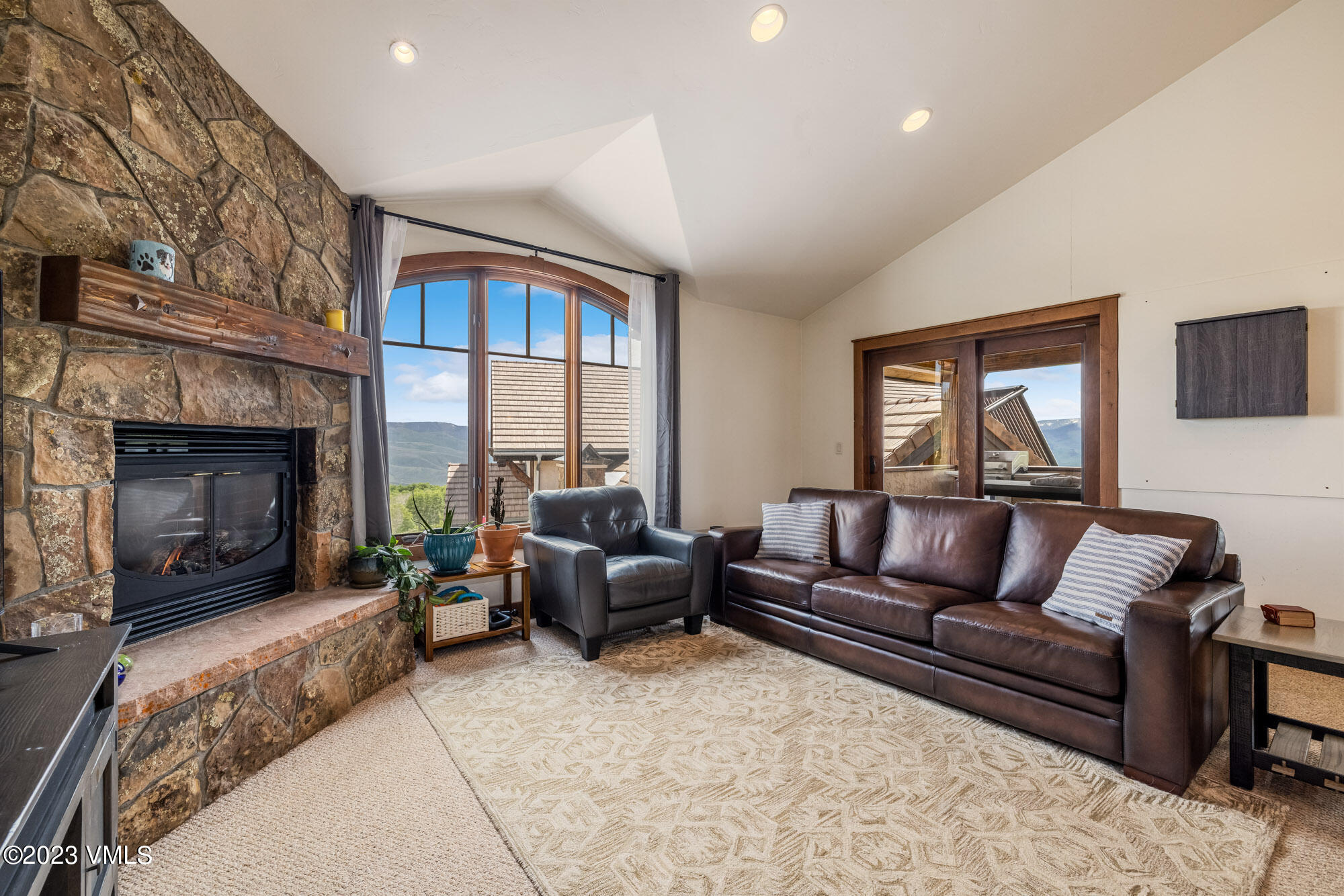 5458 Bellyache Ridge Road Wolcott, CO 81655 - Photo 31 of 63 a living room with furniture and a fireplace