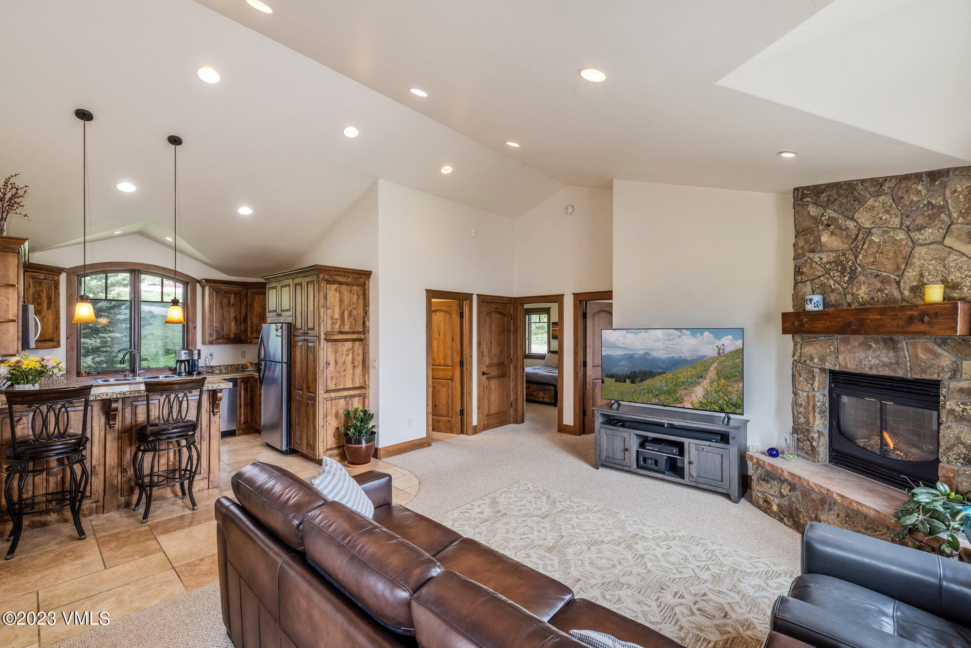 5458 Bellyache Ridge Road Wolcott, CO 81655 - Photo 32 of 63 a living room with furniture a flat screen tv and a fireplace