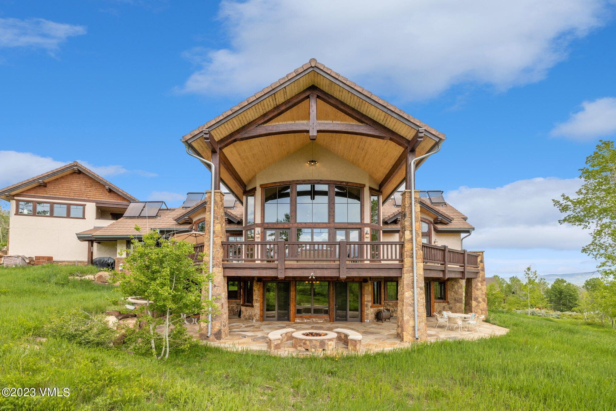 5458 Bellyache Ridge Road Wolcott, CO 81655 - Photo 38 of 63 a front view of a house with a yard table and chairs