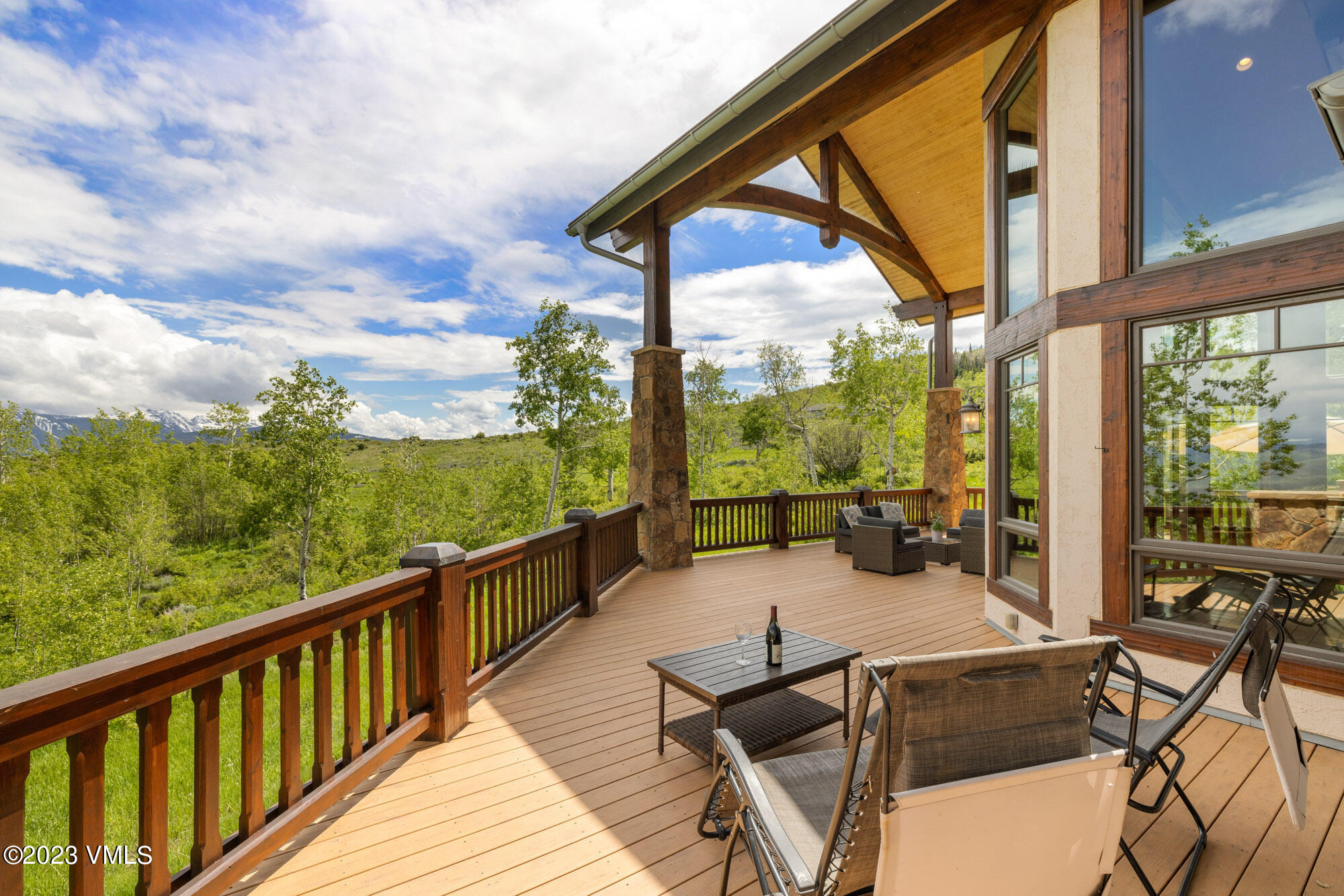 5458 Bellyache Ridge Road Wolcott, CO 81655 - Photo 42 of 63 a balcony with wooden floor table and chairs