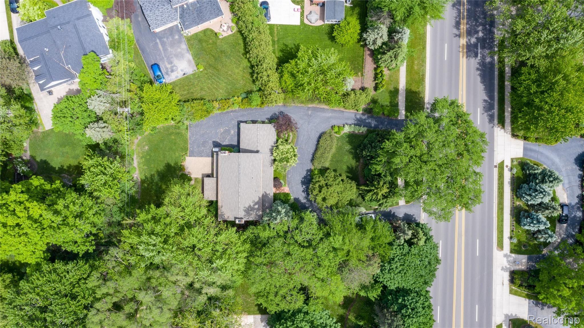 3440 West Maple Road Bloomfield Hills, MI 48301 - Photo 2 of 42 Mature trees provide private setting