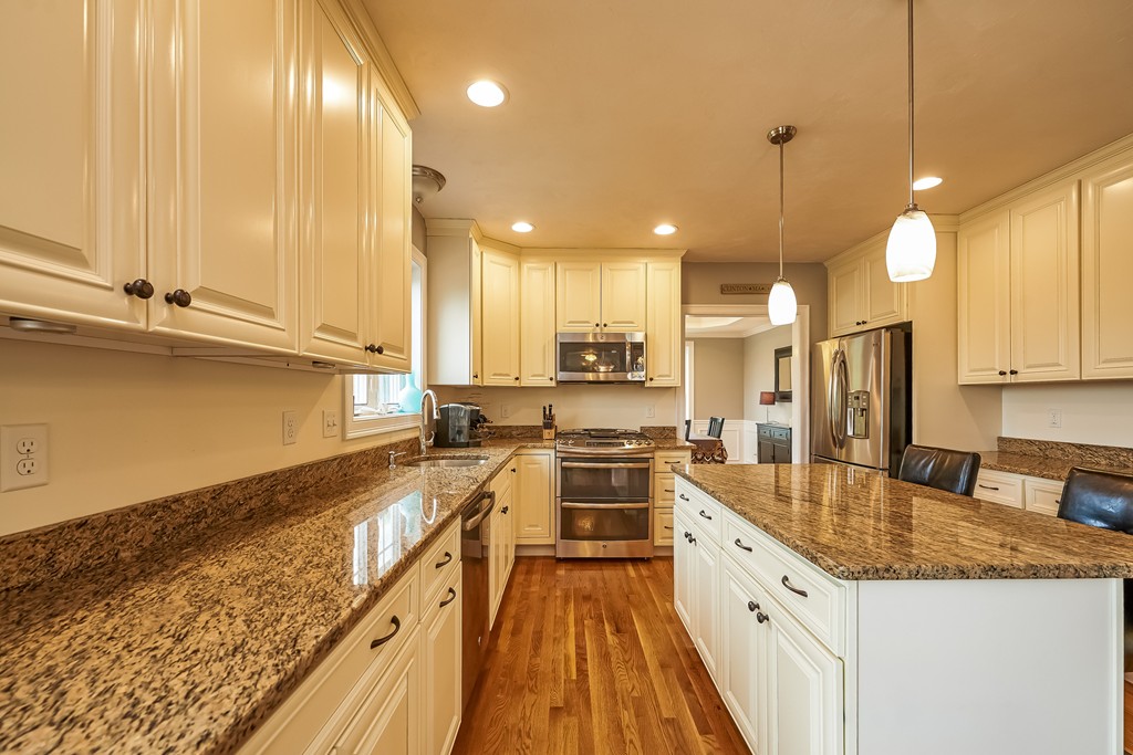 13 West Ledge Road Clinton, MA 01510 - Photo 12 of 30 a large kitchen with stainless steel appliances kitchen island granite countertop a sink and cabinets