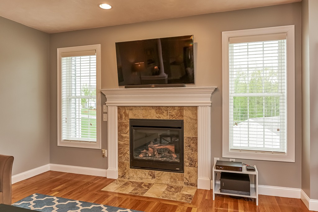 13 West Ledge Road Clinton, MA 01510 - Photo 14 of 30 a living room with furniture and a fireplace