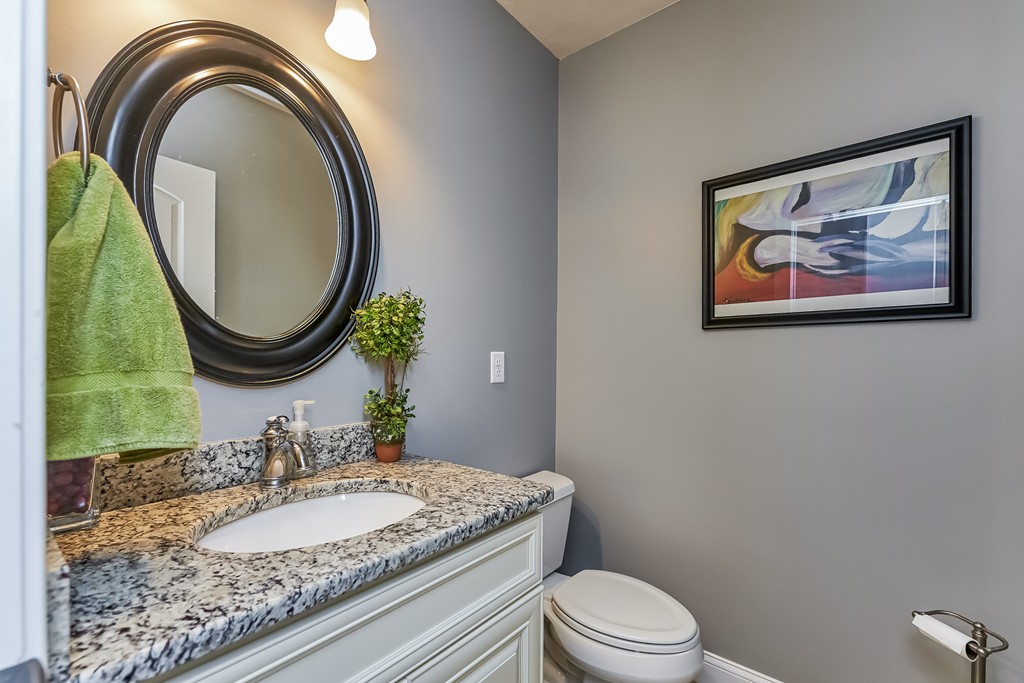 13 West Ledge Road Clinton, MA 01510 - Photo 15 of 30 a bathroom with a granite countertop toilet a sink and a mirror