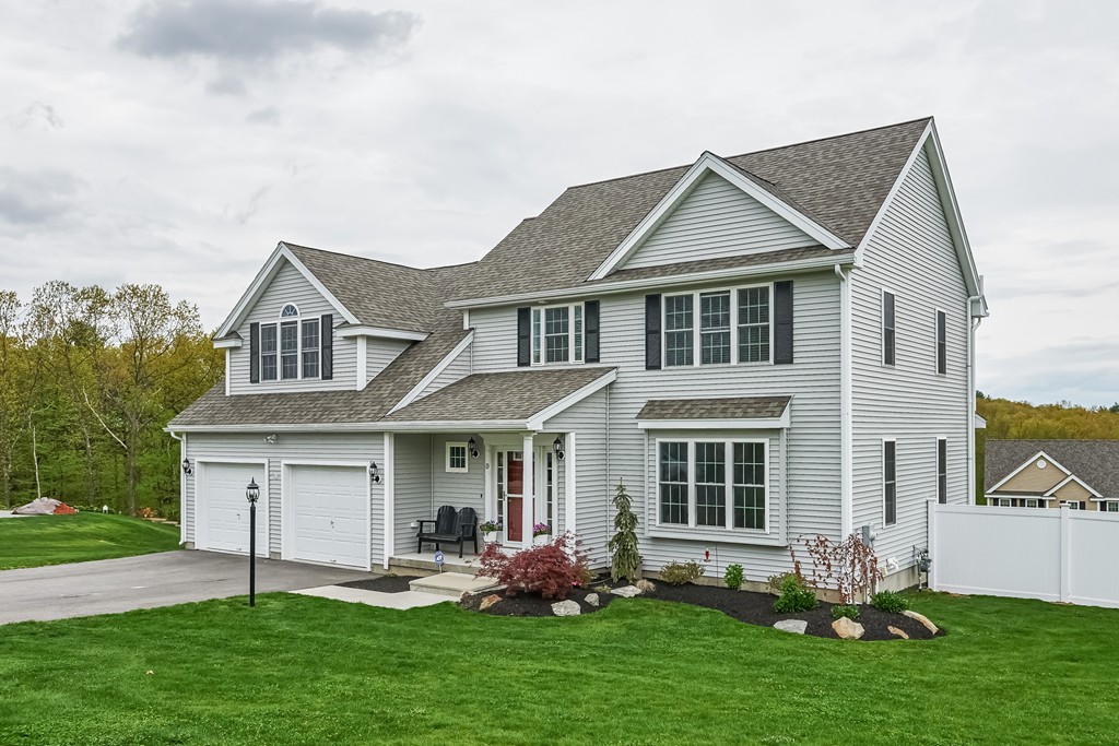 13 West Ledge Road Clinton, MA 01510 - Photo 2 of 30 a front view of a house with garden and porch