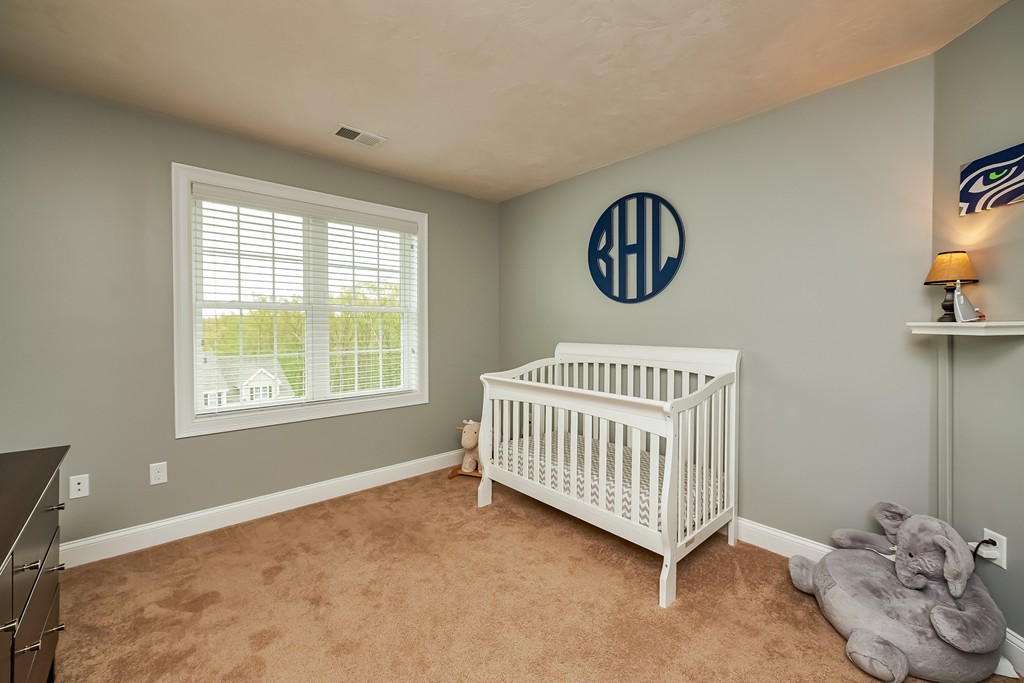 13 West Ledge Road Clinton, MA 01510 - Photo 21 of 30 a bedroom with a window and a ceiling fan