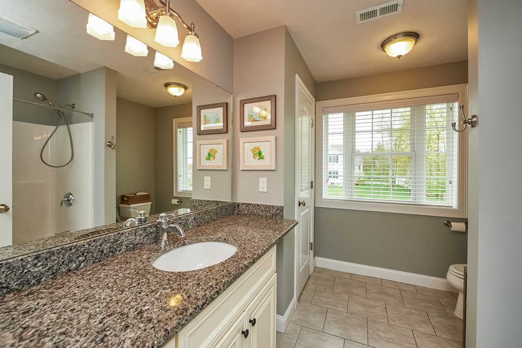 13 West Ledge Road Clinton, MA 01510 - Photo 23 of 30 a bathroom with a granite countertop sink and a mirror