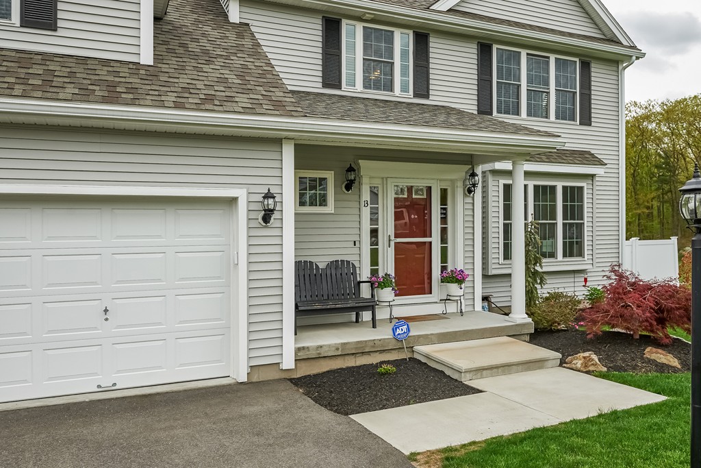 13 West Ledge Road Clinton, MA 01510 - Photo 3 of 30 a front view of a house with a garage