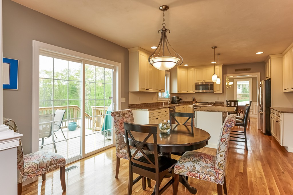 13 West Ledge Road Clinton, MA 01510 - Photo 9 of 30 a view of a dining room with furniture wooden floor and a chandelier