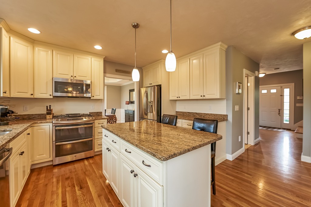 13 West Ledge Road Clinton, MA 01510 - Photo 10 of 30 a kitchen with stainless steel appliances granite countertop a kitchen island a stove and a sink
