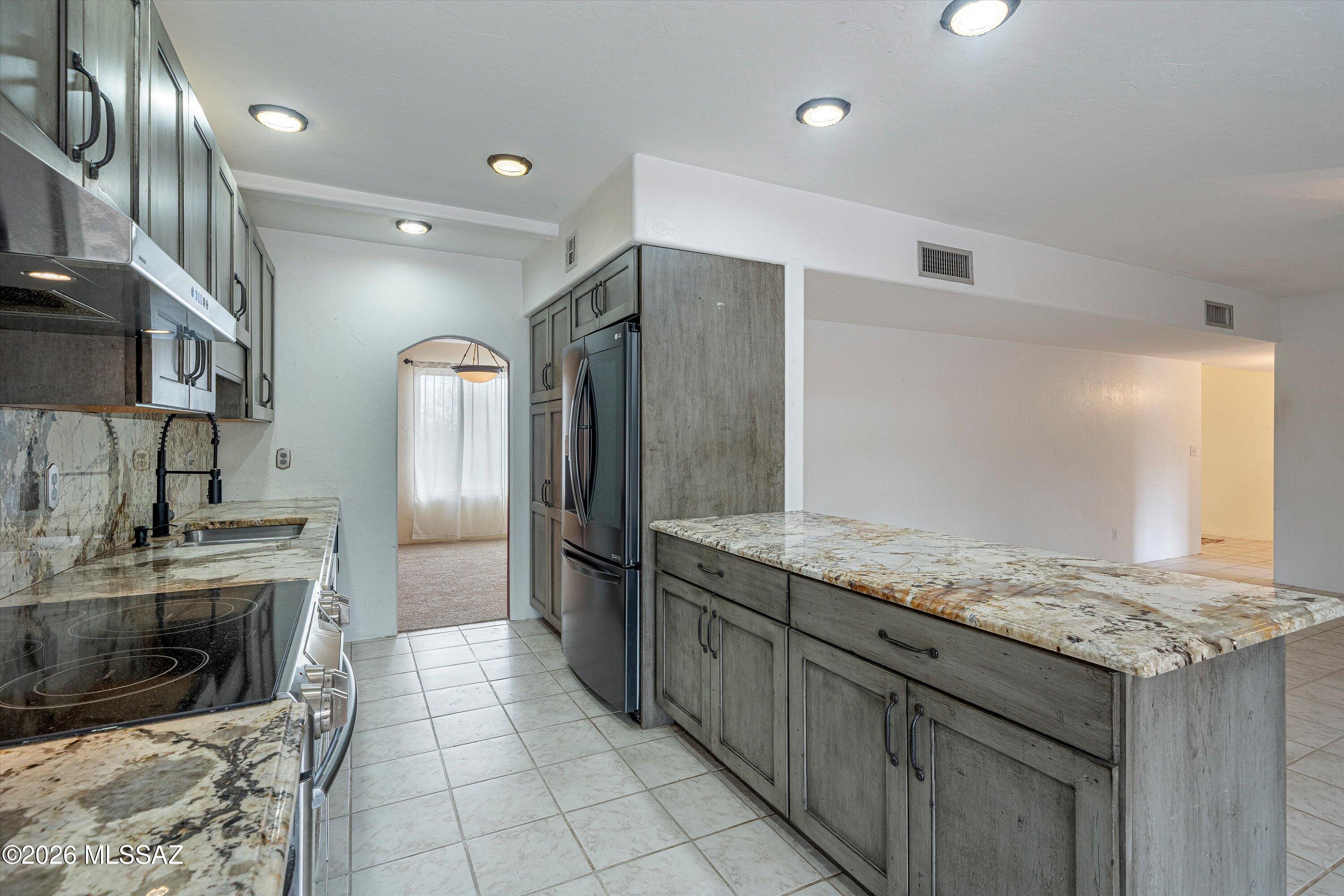 10961 East Roger Road Tucson, AZ 85749 - Photo 30 of 45 Updated granite kitchen