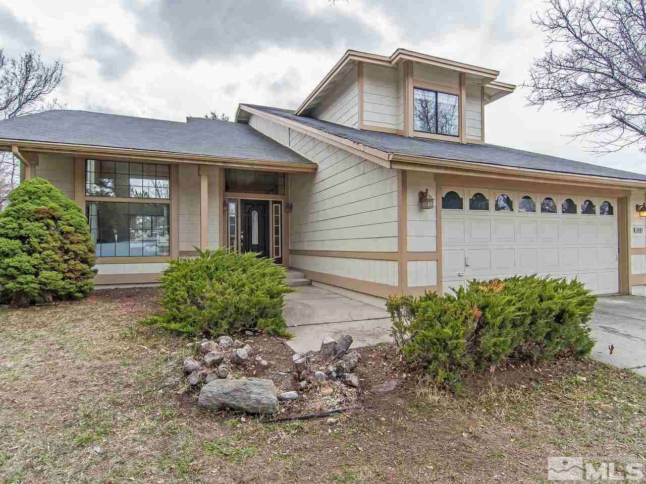 5302 Vista Ridge Way Reno, NV 89523 - Photo 1 of 20 a front view of a house with garden