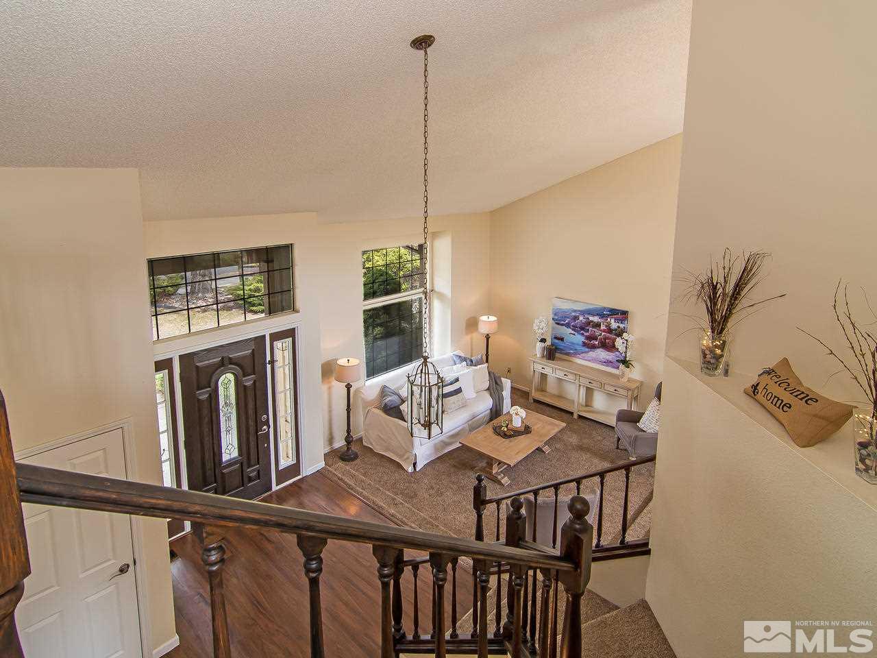 5302 Vista Ridge Way Reno, NV 89523 - Photo 12 of 20 a view of a dining room with furniture window and wooden floor