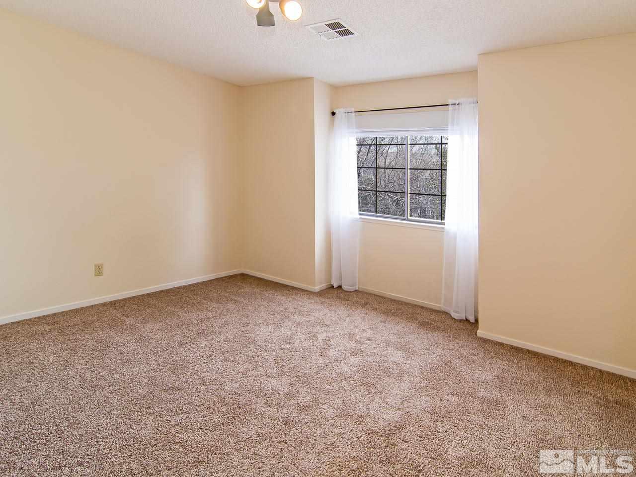 5302 Vista Ridge Way Reno, NV 89523 - Photo 16 of 20 an empty room with windows