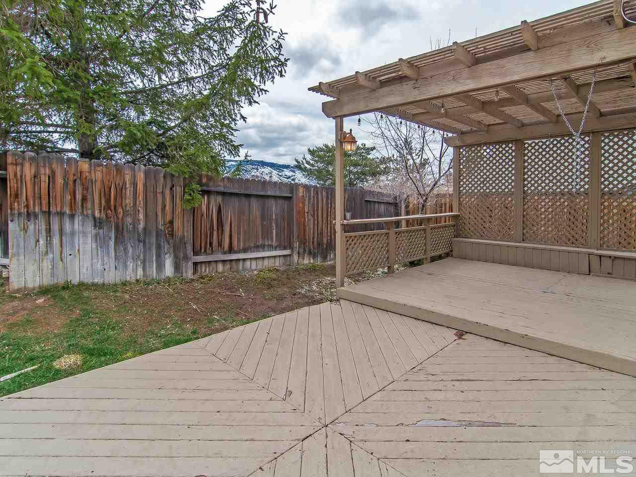 5302 Vista Ridge Way Reno, NV 89523 - Photo 18 of 20 a view of backyard with wooden fence