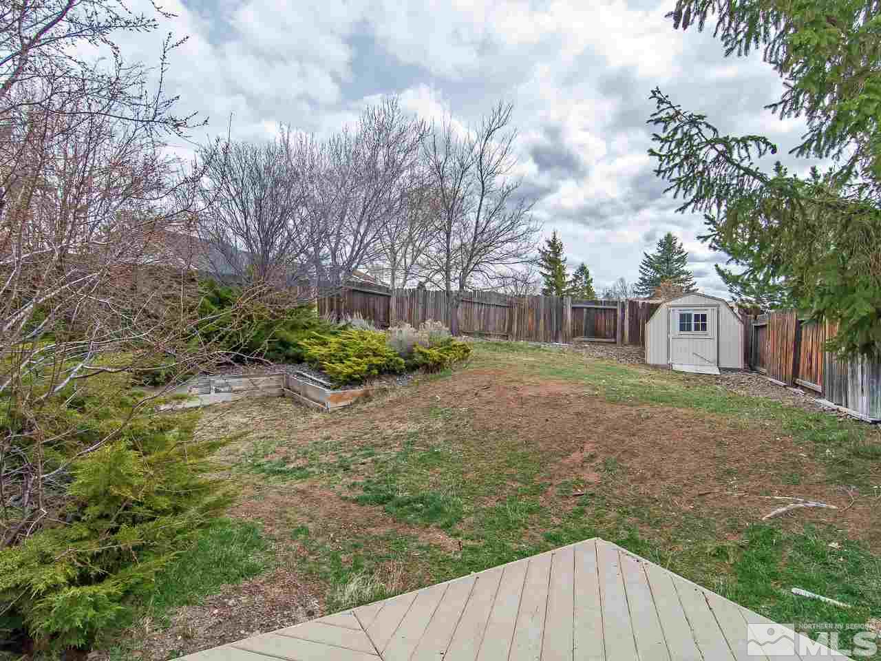 5302 Vista Ridge Way Reno, NV 89523 - Photo 19 of 20 a view of a backyard with plants and trees