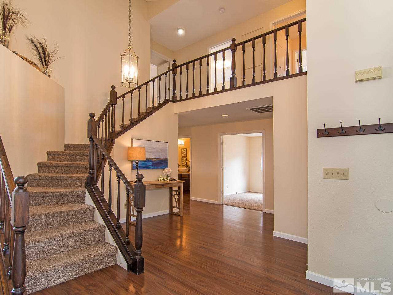5302 Vista Ridge Way Reno, NV 89523 - Photo 2 of 20 a view of staircase with white walls and a window