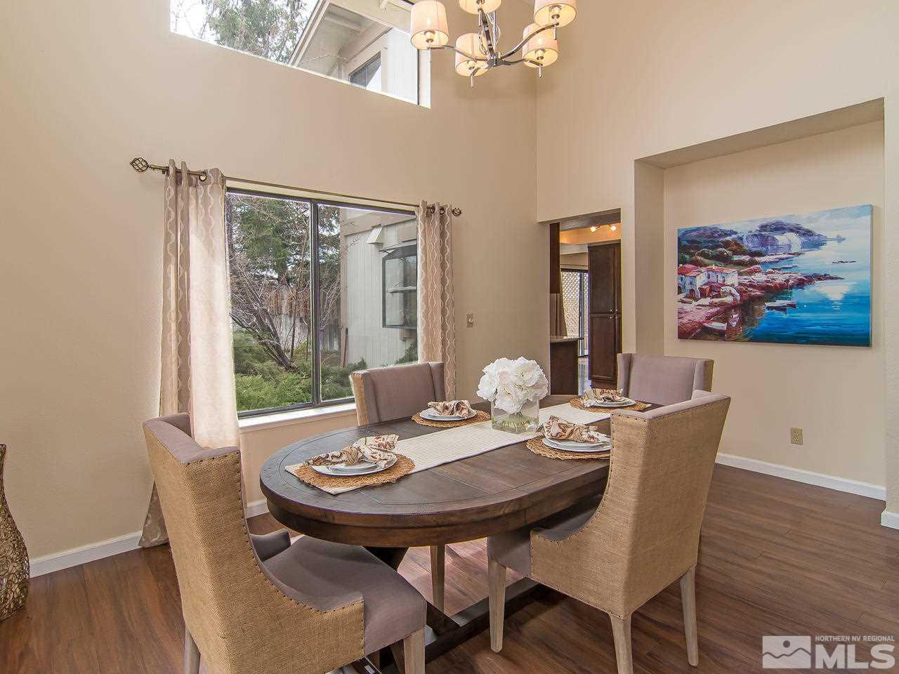5302 Vista Ridge Way Reno, NV 89523 - Photo 5 of 20 a view of a dining room with furniture window and wooden floor