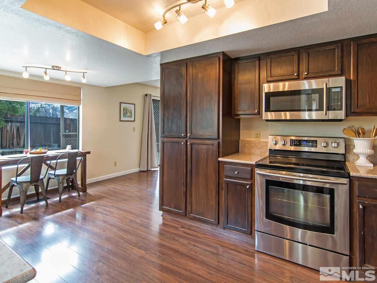 5302 Vista Ridge Way Reno, NV 89523 - Photo 6 of 20 a kitchen with a stove microwave and refrigerator