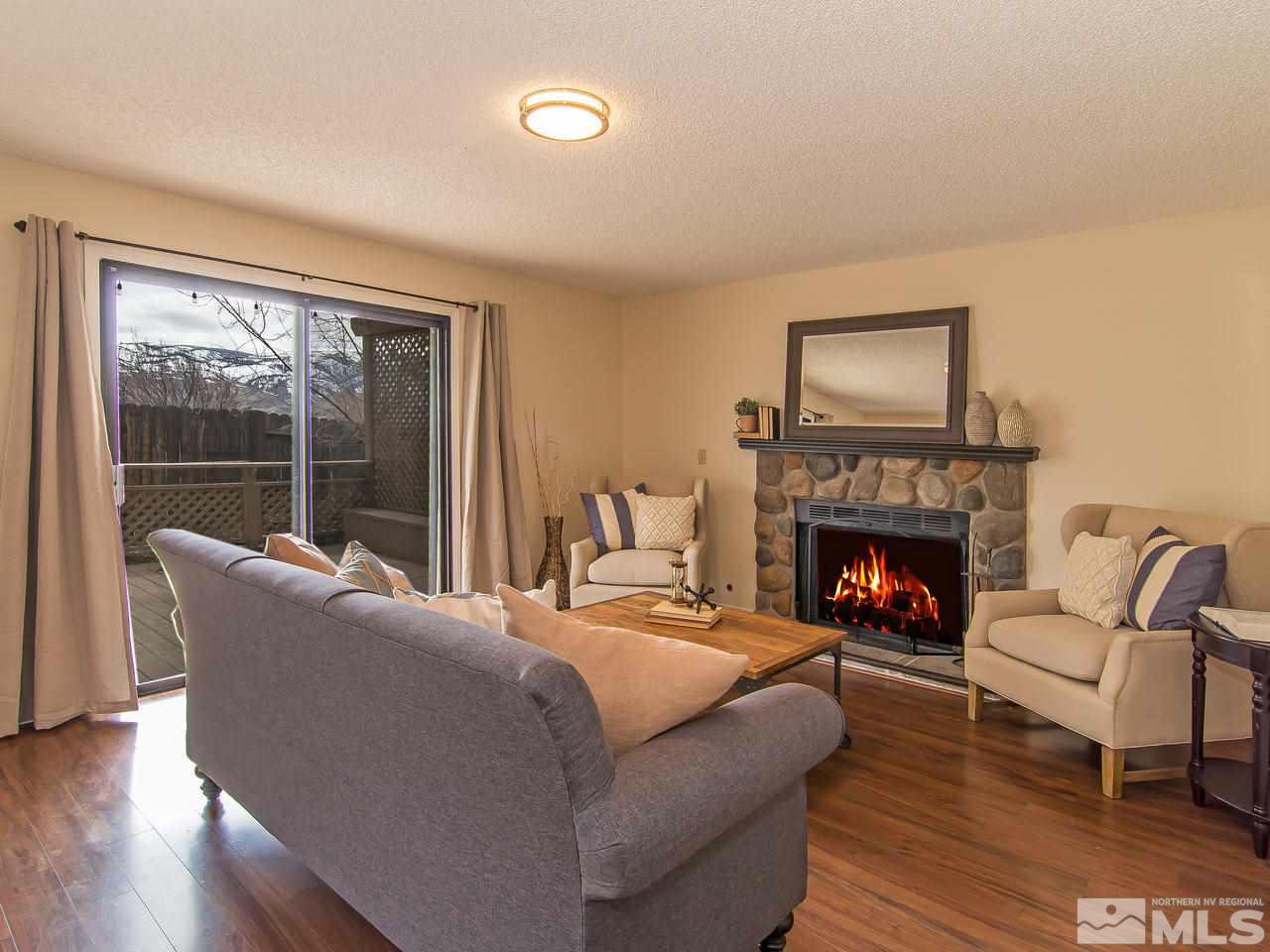 5302 Vista Ridge Way Reno, NV 89523 - Photo 9 of 20 a living room with furniture and a fireplace