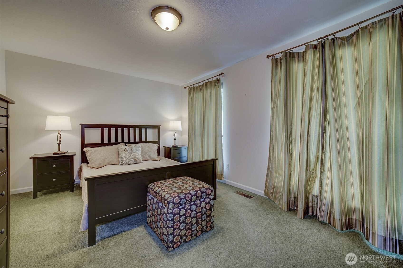 3142 Sahali Drive Bremerton, WA 98310 - Photo 18 of 23 a bedroom with a bed and a night stand