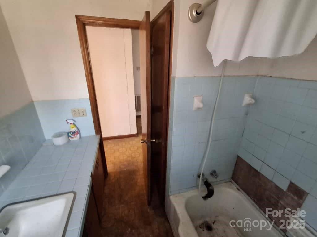 8092 Riverview Road Norwood, NC 28128 - Photo 29 of 45 a bathroom with a sink and a mirror