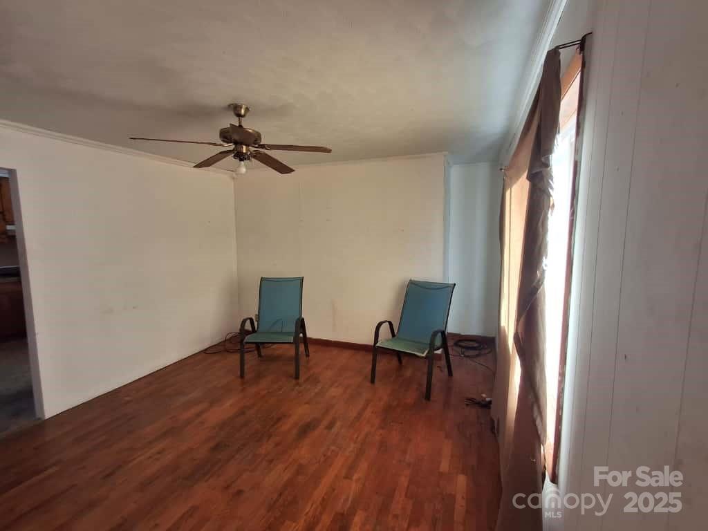 8092 Riverview Road Norwood, NC 28128 - Photo 8 of 45 a view of a workspace with furniture and a window