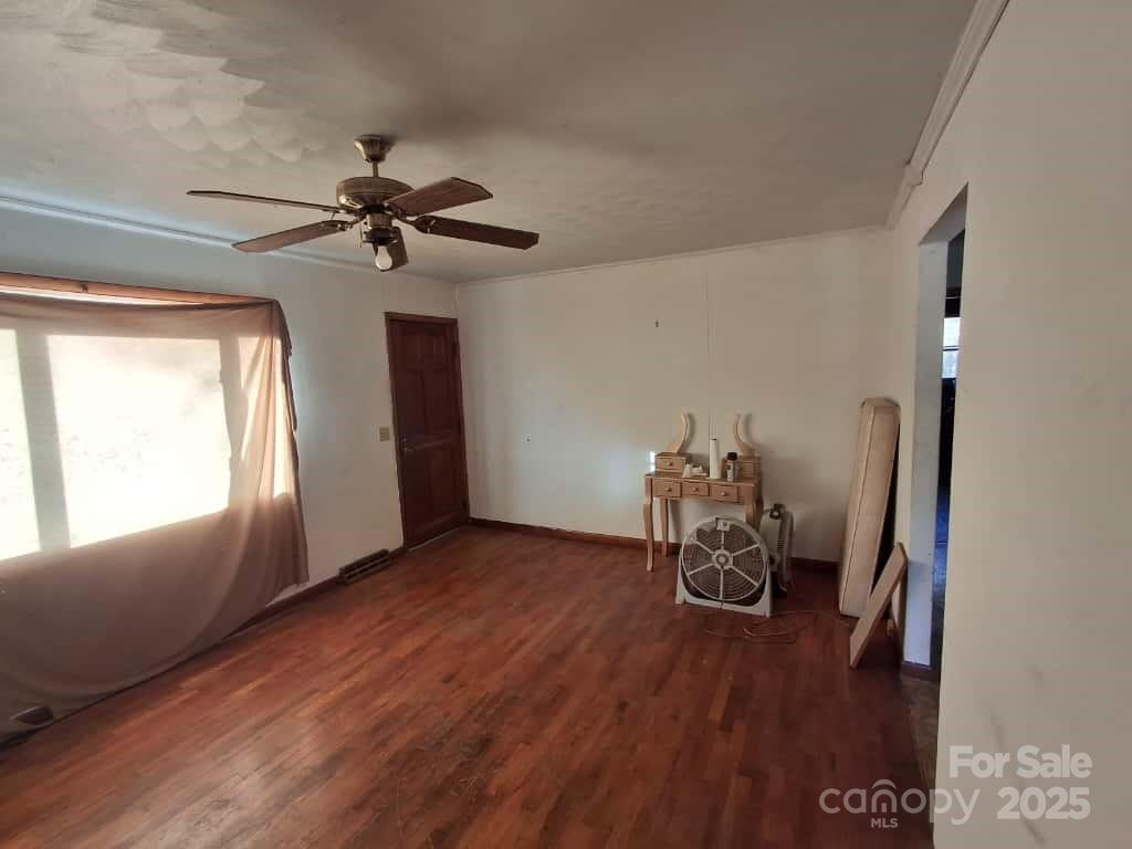 8092 Riverview Road Norwood, NC 28128 - Photo 9 of 45 a room with furniture and a chandelier