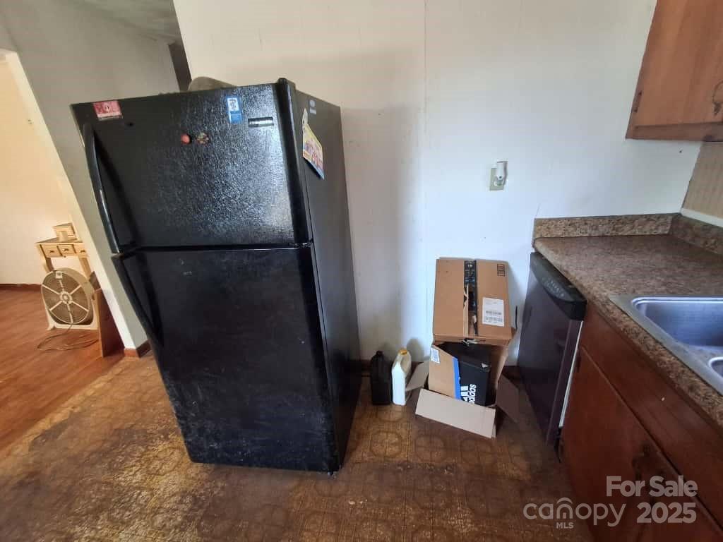 8092 Riverview Road Norwood, NC 28128 - Photo 10 of 45 a view of workspace with furniture and refrigerator