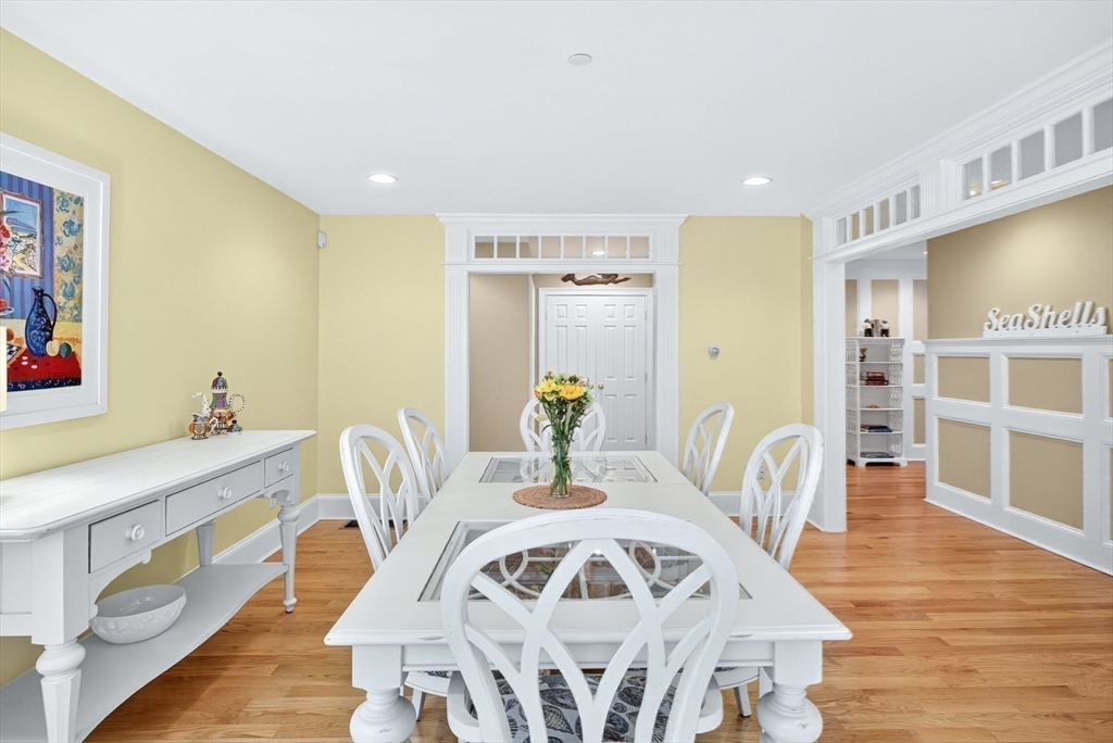 199 East Bay Road, Unit 13 Barnstable, MA 02655 - Photo 11 of 40 a view of a dining room with furniture and wooden floor