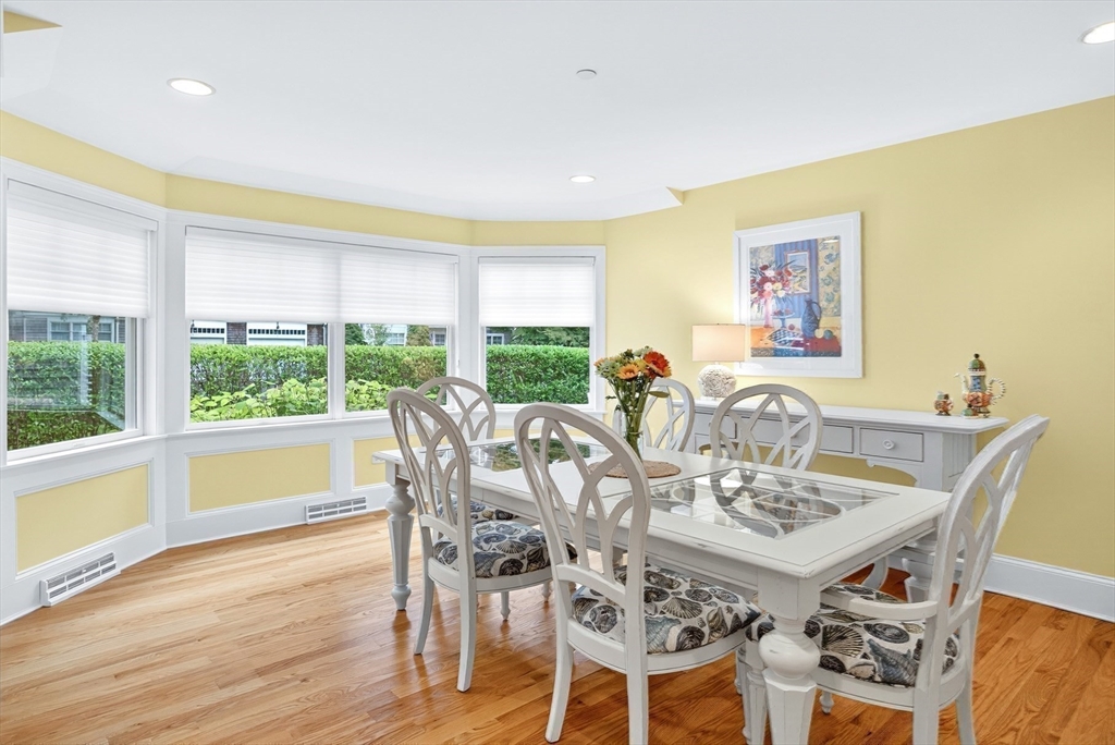 199 East Bay Road, Unit 13 Barnstable, MA 02655 - Photo 12 of 40 a view of a dining room with furniture window and wooden floor
