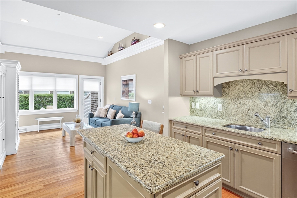 199 East Bay Road, Unit 13 Barnstable, MA 02655 - Photo 14 of 40 a kitchen with a stove and white cabinets