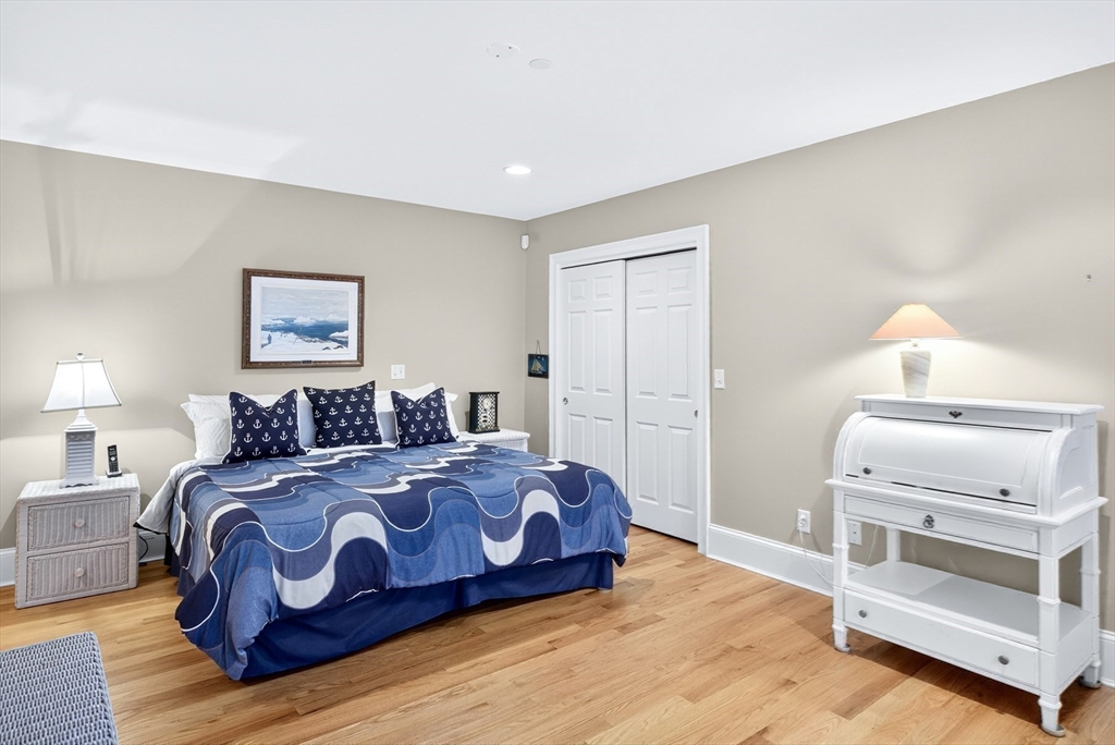 199 East Bay Road, Unit 13 Barnstable, MA 02655 - Photo 18 of 40 a bedroom with a bed and a dresser