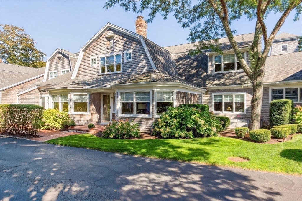 199 East Bay Road, Unit 13 Barnstable, MA 02655 - Photo 2 of 40 front view of a house with a yard