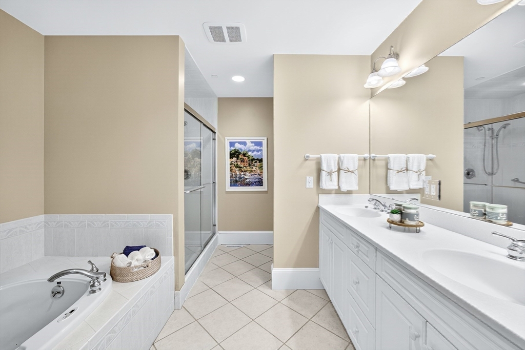 199 East Bay Road, Unit 13 Barnstable, MA 02655 - Photo 21 of 40 a bathroom with a double vanity sink mirror and toilet