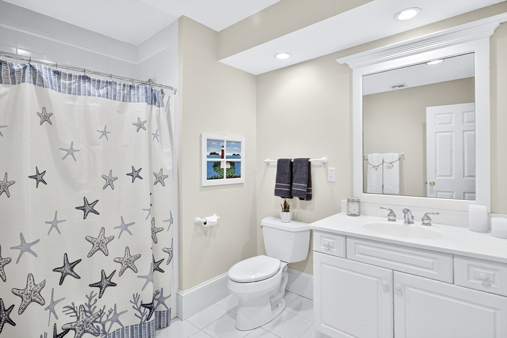 199 East Bay Road, Unit 13 Barnstable, MA 02655 - Photo 26 of 40 a bathroom with a sink toilet and shower