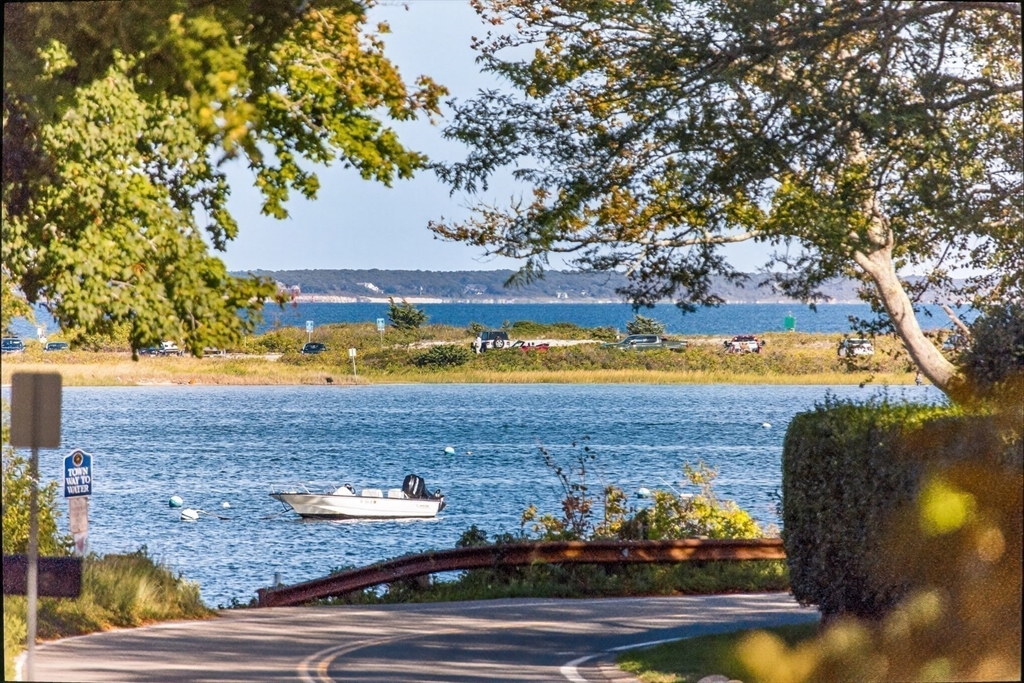 199 East Bay Road, Unit 13 Barnstable, MA 02655 - Photo 4 of 40 a view of a lake with houses
