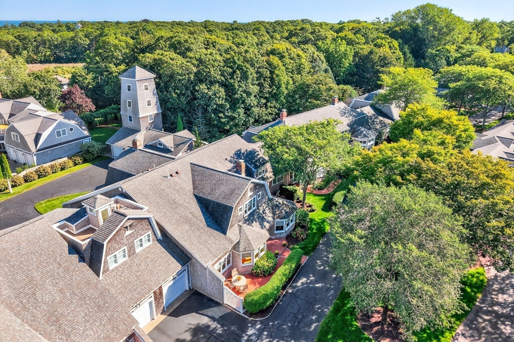 199 East Bay Road, Unit 13 Barnstable, MA 02655 - Photo 6 of 40 an aerial view of a house with a yard and lake view