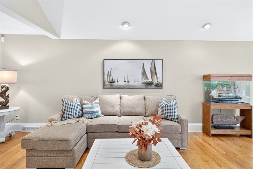 199 East Bay Road, Unit 13 Barnstable, MA 02655 - Photo 10 of 40 a living room with furniture and wooden floor