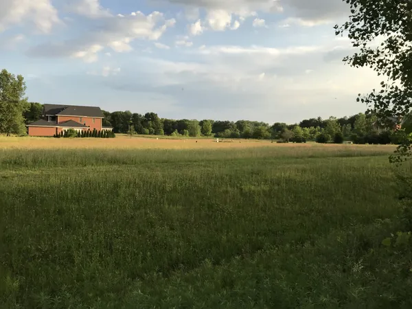 a view of a lake with a big yard