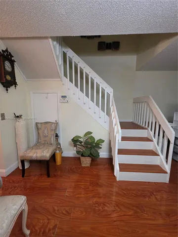 a view of entryway with wooden floor